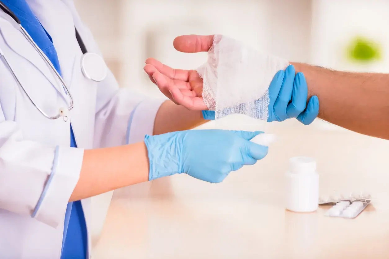 A doctor bandaging a patient's wrist