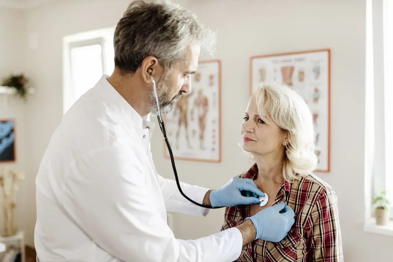 A doctor examining a patient with a stethoscope